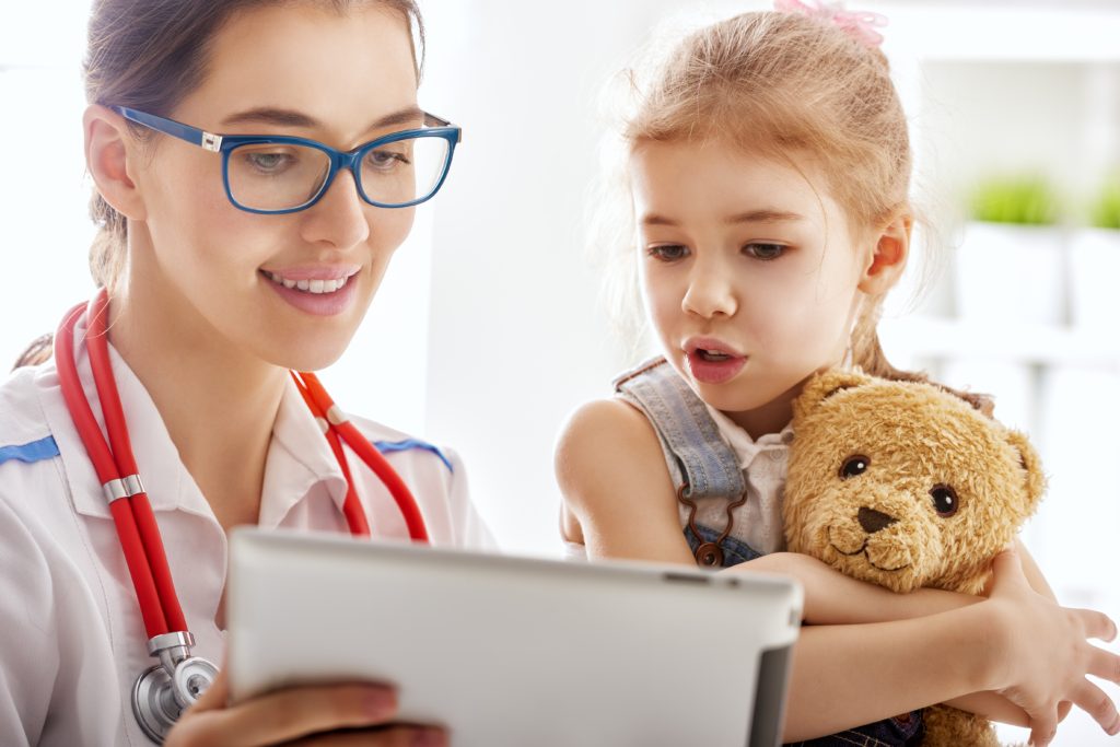 doctor examining a child