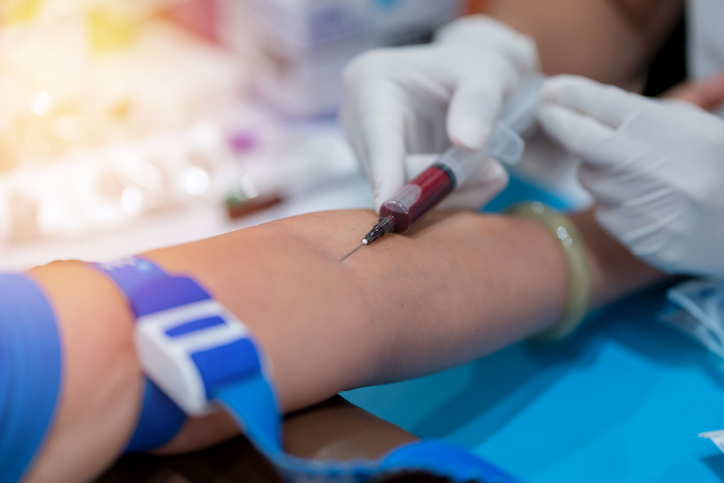 Nurse collecting a blood from patient