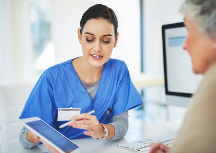 Nurse consulting her patient and informing them