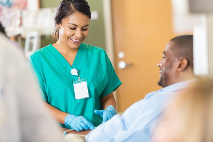 Nice hospital phlebotomist taking a sample from a patient